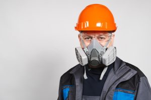 man wearing a helmet and respirator